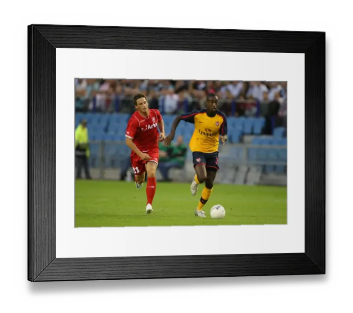 Framed Print : Djourou's Dominance: Arsenal's 2-0 Champions League Triumph over FC Twente's Arnautovic