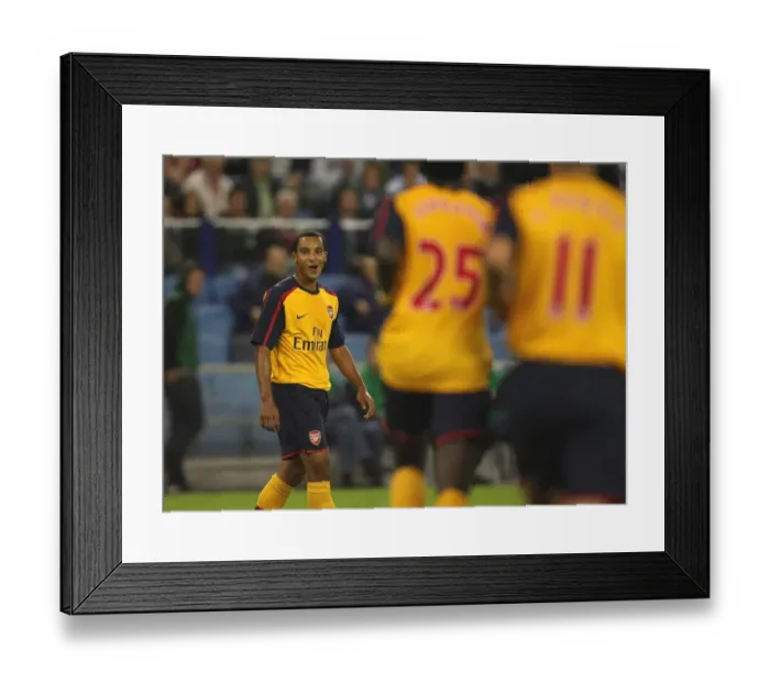 Framed Print : Theo Walcott celebrates after setting up the 2nd Arsenal goal Framed Print : Theo Walcott celebrates after setting up the 2nd Arsenal goal