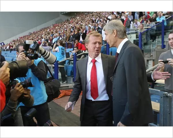 Arsenal manager Arsene Wenger with FC Twente manager Steve McClaren