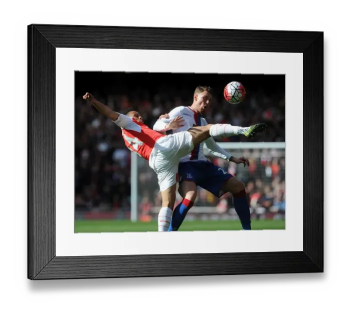 Framed Print : Coquelin vs Wickham: A Premier League Battle at Emirates Stadium Framed Print : Coquelin vs Wickham: A Premier League Battle at Emirates Stadium