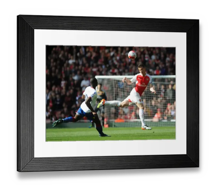 Framed Print : Koscielny Stands Firm: Arsenal Star Fends Off Bolasie Threat in Intense Premier League Showdown