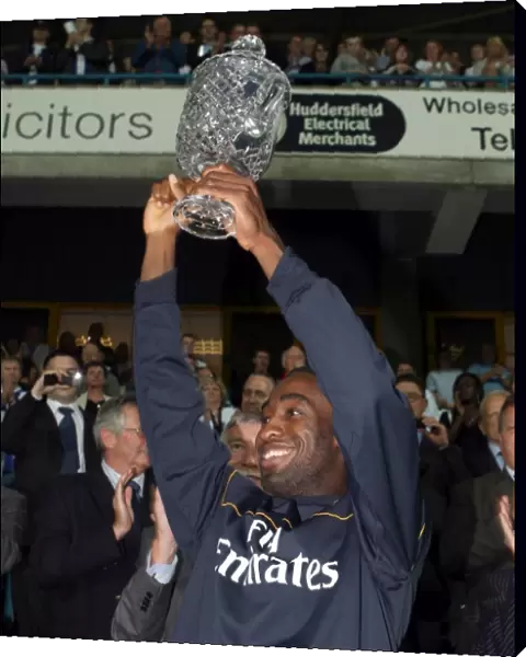 Johan Djourou (Arsenal) lifts the Chapman trophy