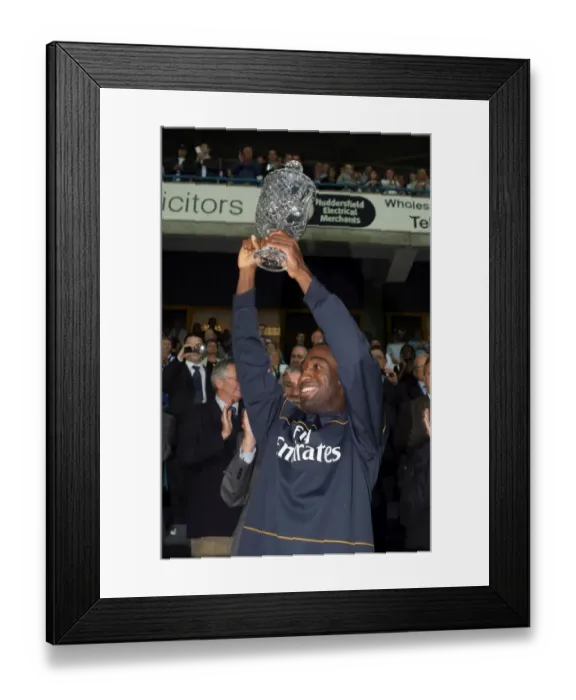 Framed Print : Johan Djourou (Arsenal) lifts the Chapman trophy Framed Print : Johan Djourou (Arsenal) lifts the Chapman trophy