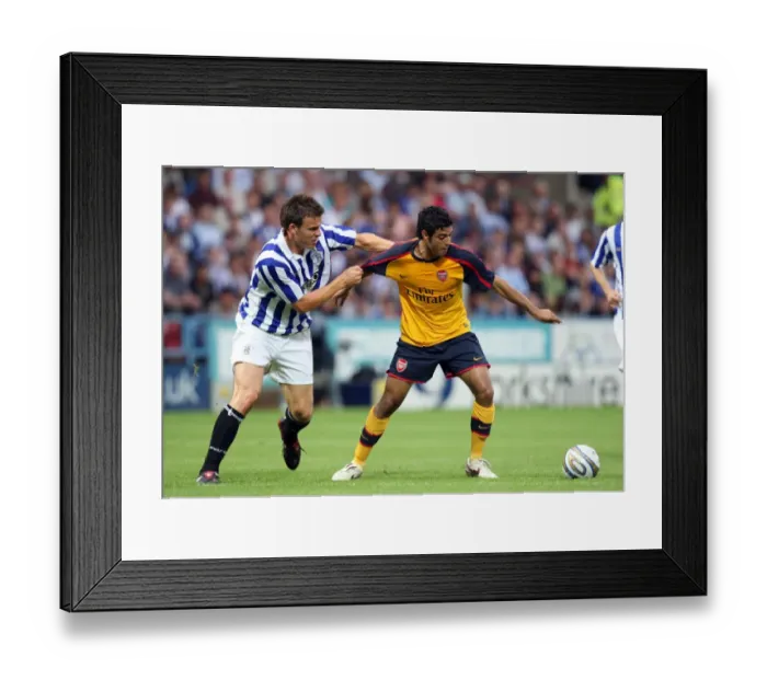 Framed Print : Vela's Brilliant Brace: Arsenal Edge Past Huddersfield in Pre-Season Friendly