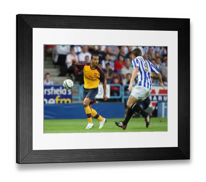 Framed Print : Theo Walcott (Arsenal) Andy Butler (Huddersfield)