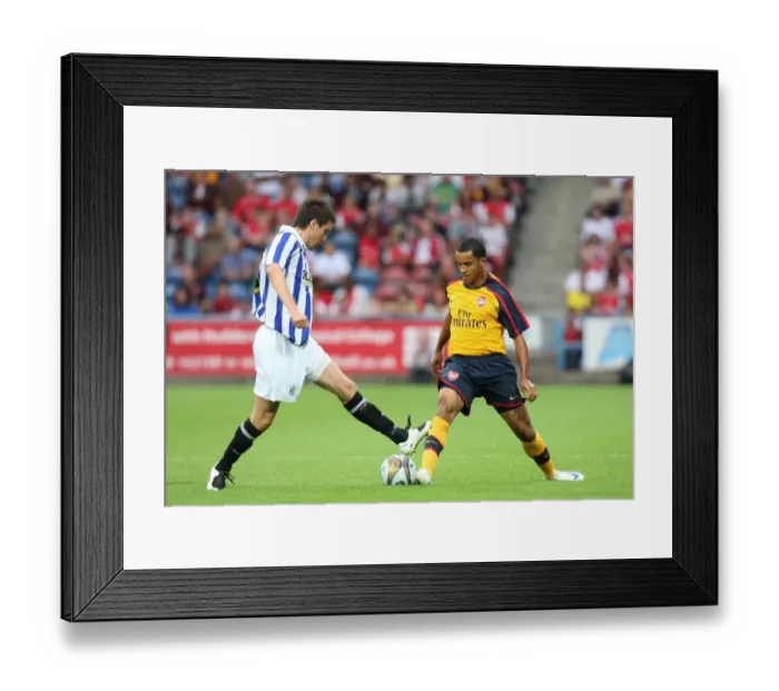 Framed Print : Theo Walcott's Slick Nutmeg: Arsenal's 2-1 Pre-Season Victory Over Huddersfield Framed Print : Theo Walcott's Slick Nutmeg: Arsenal's 2-1 Pre-Season Victory Over Huddersfield