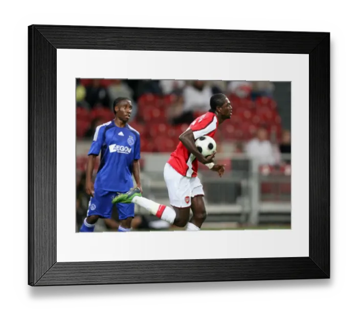 Framed Print : Adebayor's Thrilling Goal: Arsenal's Comeback at Amsterdam Tournament (2:3 against Ajax) Framed Print : Adebayor's Thrilling Goal: Arsenal's Comeback at Amsterdam Tournament (2:3 against Ajax)