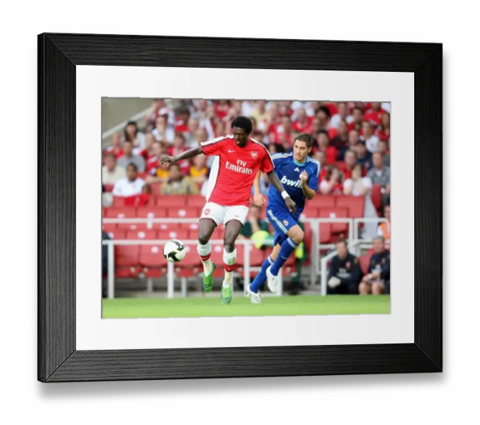 Framed Print : Emmanuel Adebayor (Arsenal) Miguel Torres (Real) Framed Print : Emmanuel Adebayor (Arsenal) Miguel Torres (Real)