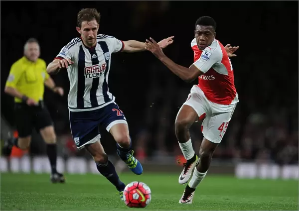 Intense Face-Off: Iwobi vs. McAuley in Arsenal's Battle Against West Brom