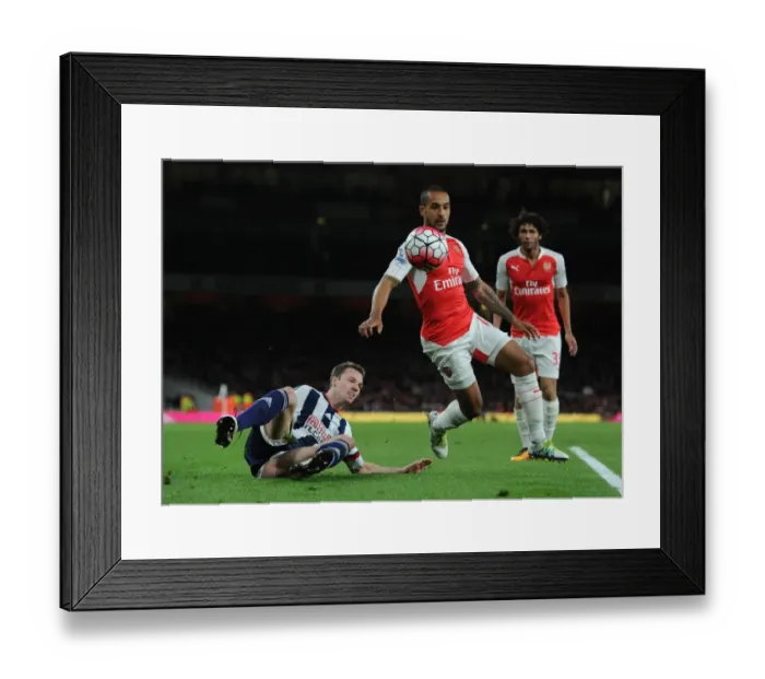 Framed Print : Theo Walcott vs Jonny Evans: A Battle of Determination in Arsenal vs West Bromwich Albion (2015-16) Framed Print : Theo Walcott vs Jonny Evans: A Battle of Determination in Arsenal vs West Bromwich Albion (2015-16)