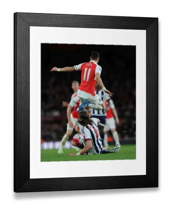 Framed Print : Mesut Ozil (Arsenal) Jonas Olsson (WBA). Arsenal 2: 0 West Bromwich Albion