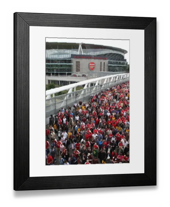 Framed Print : Arsenal fans make their way home after the match crossing