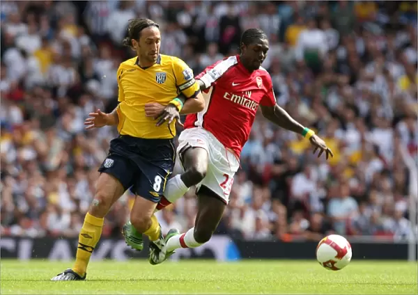 Emmanuel Adebayor (Arsenal) Jonathan Greening (WBA)