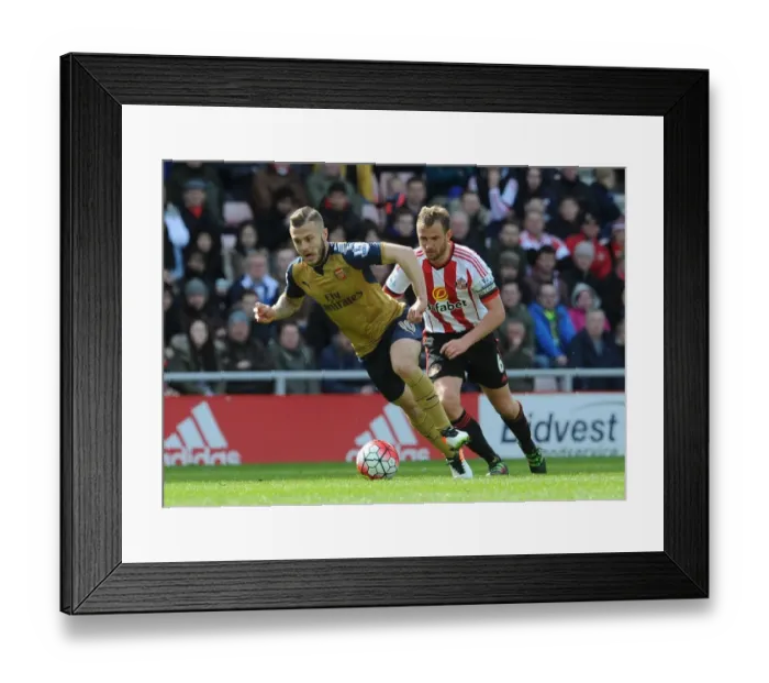 Framed Print : Intense Rivalry: Jack Wilshere vs. Lee Cattermole in Arsenal's Battle Against Sunderland