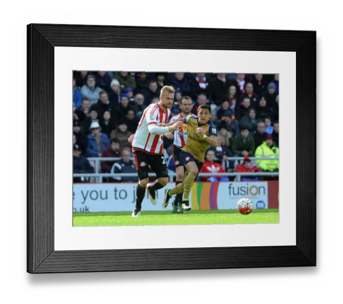 Framed Print : Arsenal's Alexis Sanchez Faces Off Against Sunderland's Jan Kirchhoff in Premier League Clash Framed Print : Arsenal's Alexis Sanchez Faces Off Against Sunderland's Jan Kirchhoff in Premier League Clash