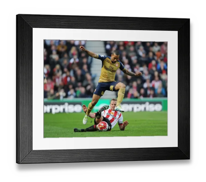 Framed Print : Theo Walcott vs. Lee Cattermole: A Premier League Battle at Sunderland's Stadium of Light (April 2016)