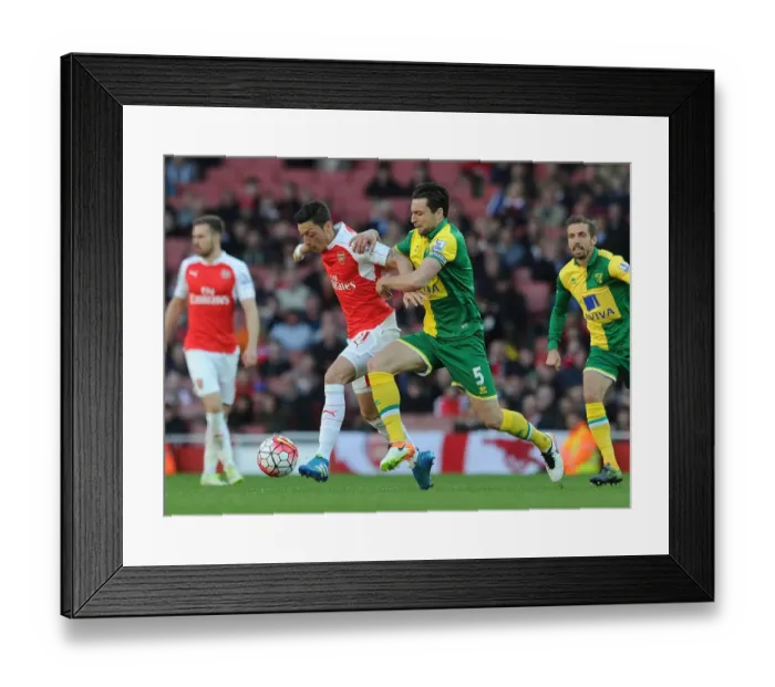 Framed Print : Mesut Ozil vs Russell Martin: A Battle at Arsenal vs Norwich City, Premier League 2015-16