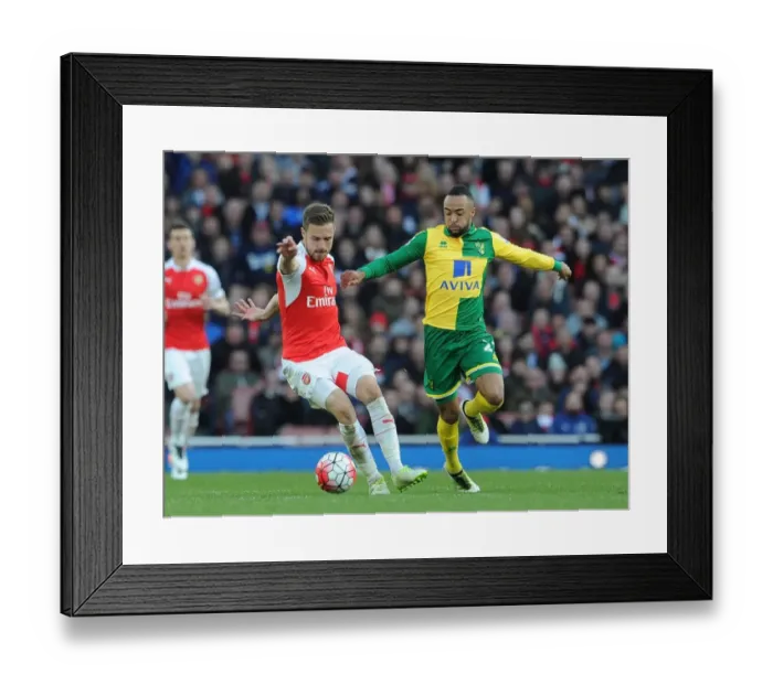 Framed Print : Arsenal's Aaron Ramsey vs. Norwich's Nathan Redmond: Intense Clash in Premier League Showdown