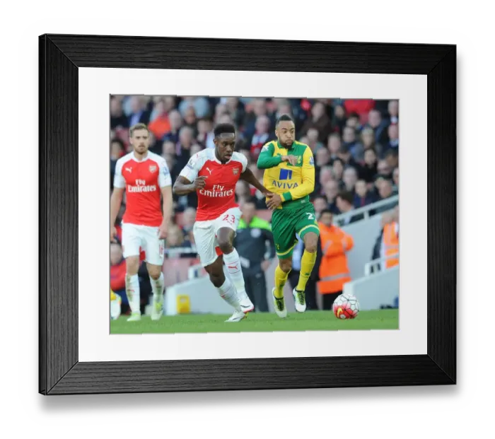 Framed Print : Arsenal's Danny Welbeck vs. Nathan Redmond: Intense Clash in Arsenal v Norwich City Premier League Match