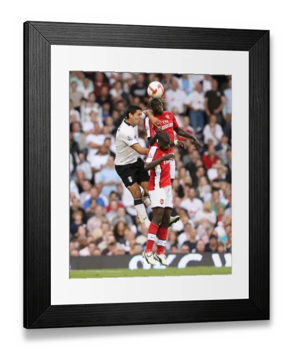 Framed Print : Bacary Sagna and Emmanuel Eboue (Arsenal) Clint Dempsey (Fulham) Framed Print : Bacary Sagna and Emmanuel Eboue (Arsenal) Clint Dempsey (Fulham)