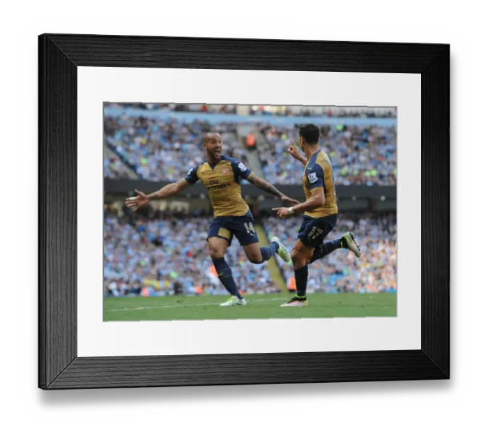 Framed Print : Alexis Sanchez and Theo Walcott's Jubilant Moment: Arsenal's Double Strike Against Manchester City (May 2016)
