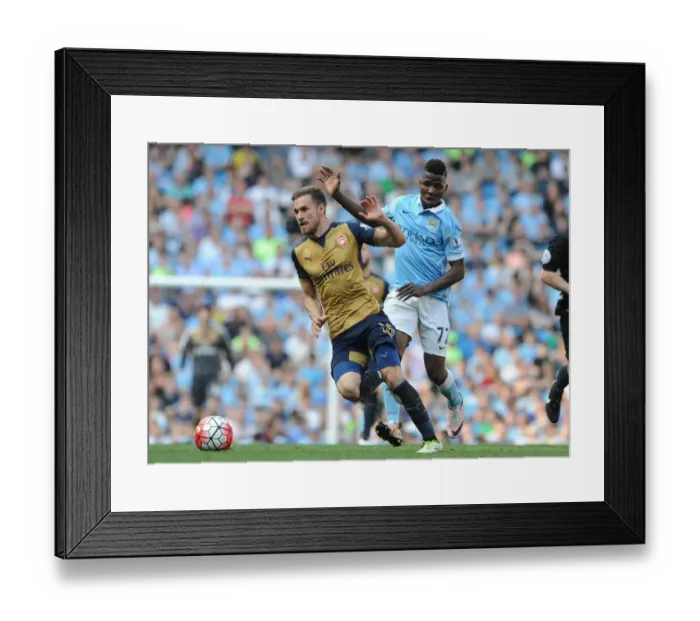 Framed Print : Ramsey vs. Iheanacho: Clash of the Stars in Manchester City vs. Arsenal Premier League Showdown Framed Print : Ramsey vs. Iheanacho: Clash of the Stars in Manchester City vs. Arsenal Premier League Showdown