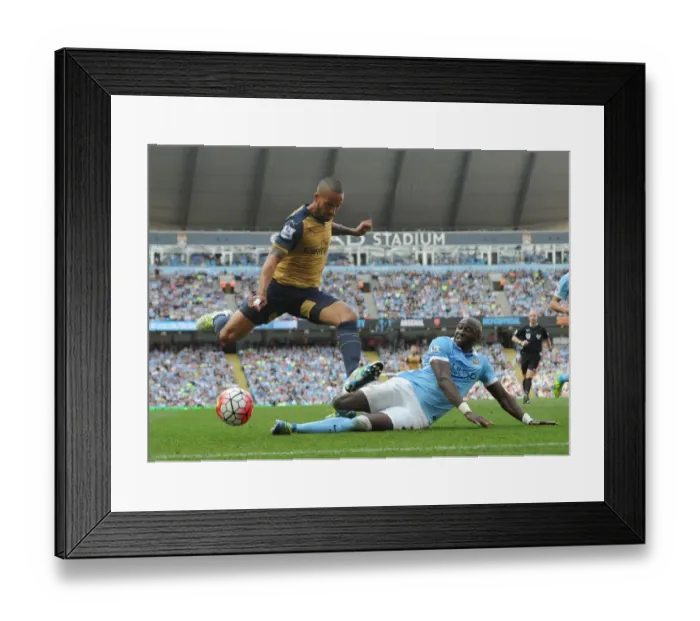 Framed Print : Theo Walcott vs Eliaquim Mangala: A Premier League Battle at Manchester City (May 2016) Framed Print : Theo Walcott vs Eliaquim Mangala: A Premier League Battle at Manchester City (May 2016)