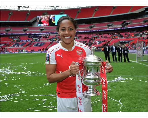 Arsenal Ladies Celebrate FA Cup Victory: Alex Scott Lifts the Trophy Over Chelsea Ladies at Wembley Stadium