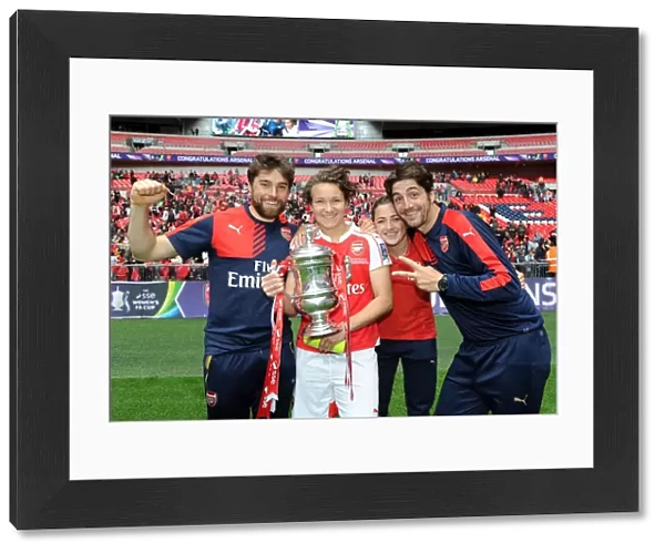 Arsenal Ladies Celebrate FA Cup Victory: Katie McCabe, Josephine Henning, and Assistant Manager Jose Elena Lift the Trophy