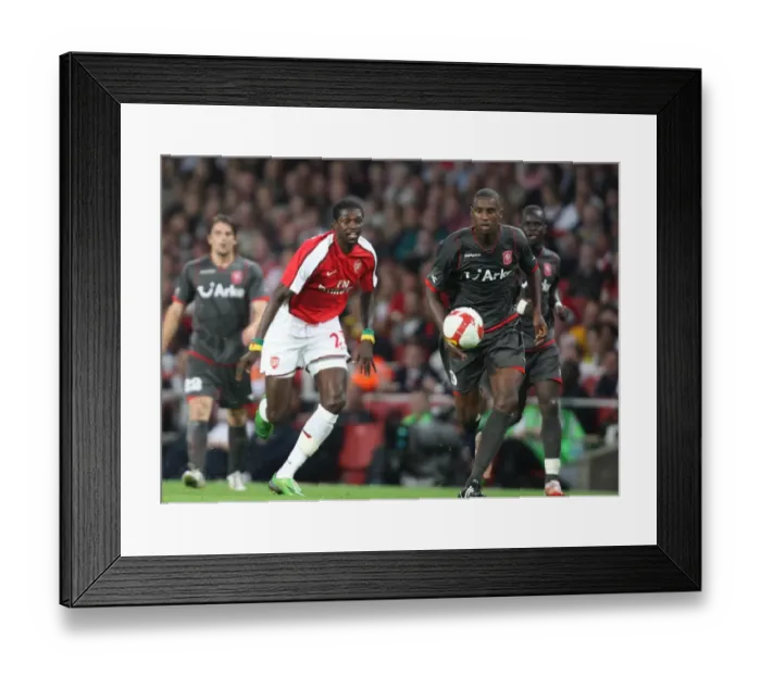 Framed Print : Emmanuel Adebayor (Arsenal) Douglas (Twente) Framed Print : Emmanuel Adebayor (Arsenal) Douglas (Twente)