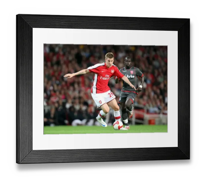 Framed Print : Arsenal's Nicklas Bendtner Scores in 4-0 UEFA Champions League Victory over FC Twente Framed Print : Arsenal's Nicklas Bendtner Scores in 4-0 UEFA Champions League Victory over FC Twente