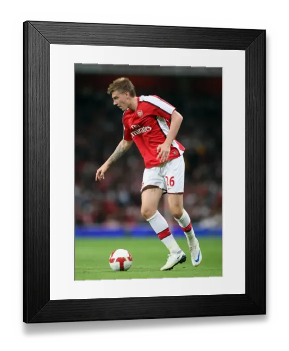 Framed Print : Arsenal's Nicklas Bendtner Scores in Dominant 4-0 UEFA Champions League Win against FC Twente Framed Print : Arsenal's Nicklas Bendtner Scores in Dominant 4-0 UEFA Champions League Win against FC Twente