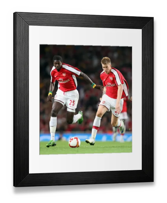Framed Print : Arsenal's Unstoppable Strike Force: Bendtner and Adebayor in Action against FC Twente (4-0)