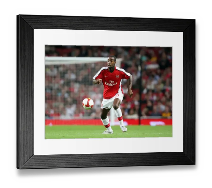 Framed Print : Arsenal's Johan Djourou Shines: 4-0 Crush of FC Twente in Champions League Qualifier
