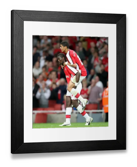 Framed Print : Emmanuel Eboue congratulates Denilson on setting up