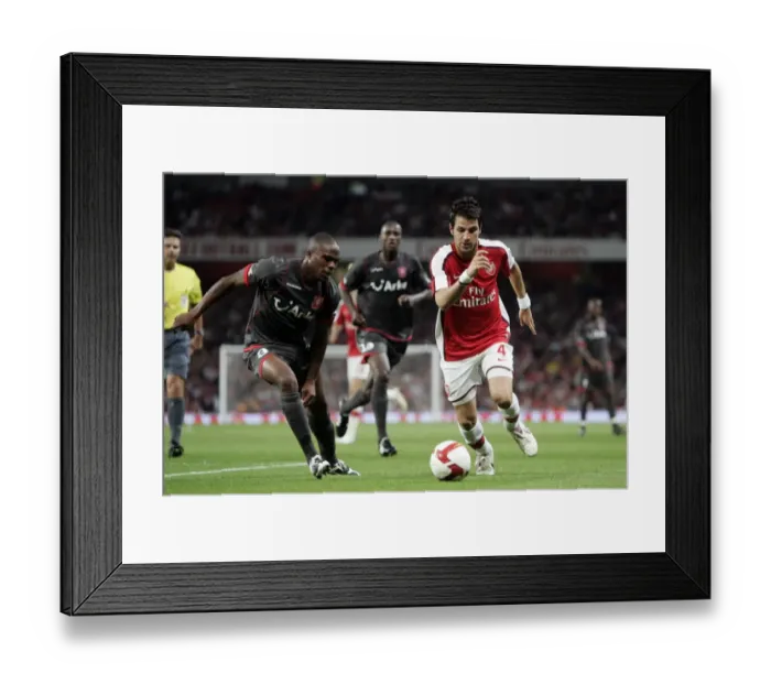 Framed Print : Arsenal's Dominance: Cesc Fabregas Scores Twice in 4-0 Win over FC Twente (UEFA Champions League) Framed Print : Arsenal's Dominance: Cesc Fabregas Scores Twice in 4-0 Win over FC Twente (UEFA Champions League)