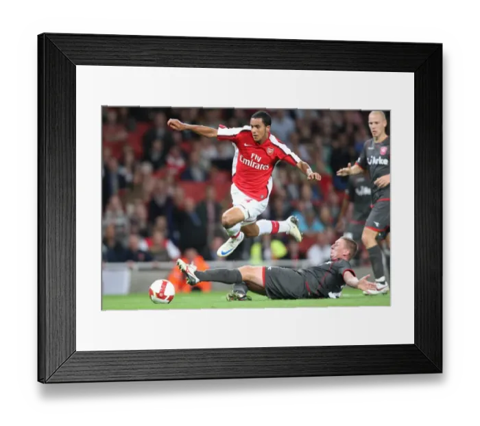 Framed Print : Theo Walcott's Unforgettable Night: Arsenal's 4-0 Champions League Victory over FC Twente Framed Print : Theo Walcott's Unforgettable Night: Arsenal's 4-0 Champions League Victory over FC Twente