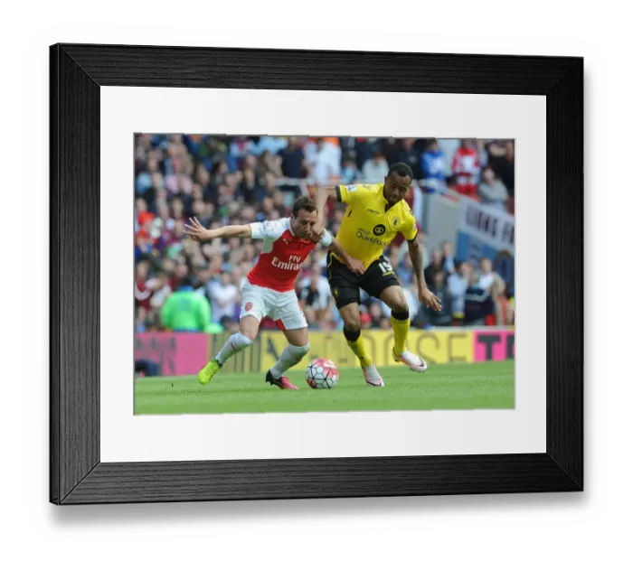 Framed Print : Intense Battle: Cazorla Holds Off Ayew in Arsenal vs. Aston Villa Clash