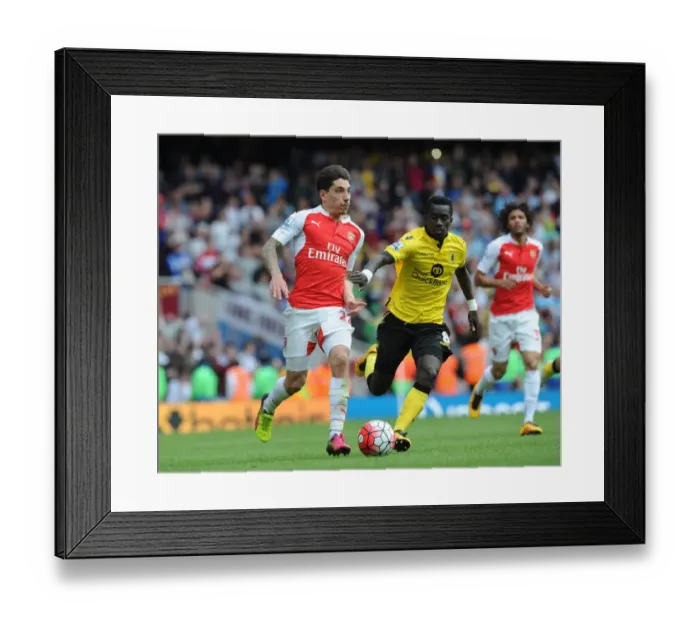 Framed Print : Arsenal vs Aston Villa: Wilshere vs Cissokho - Premier League Clash at Emirates Stadium
