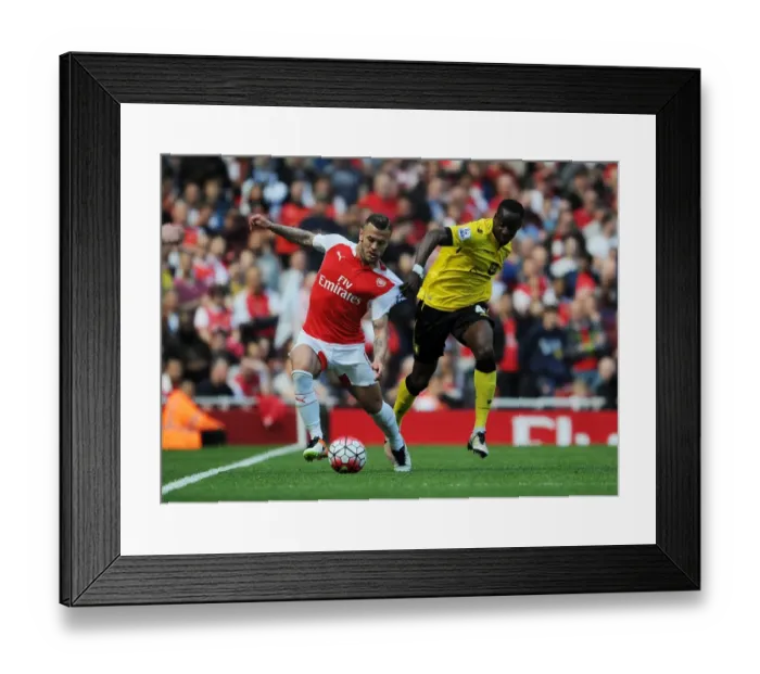 Framed Print : Arsenal's Jack Wilshere vs. Aston Villa's Aly Cissokho: A Premier League Face-Off Framed Print : Arsenal's Jack Wilshere vs. Aston Villa's Aly Cissokho: A Premier League Face-Off