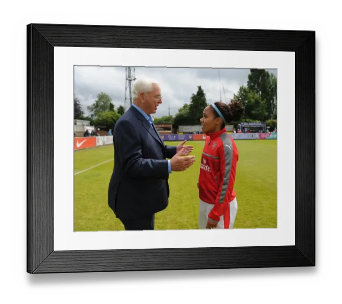Framed Print : Arsenal Chairman Sir Chips Keswick chats to Alex Scott (Arsenal Ladies) before the match