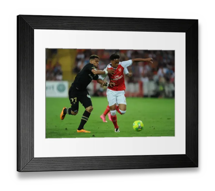 Framed Print : Arsenal's Chris Willock Scores Spectacular Goal Past Lens Defender in Pre-Season Friendly