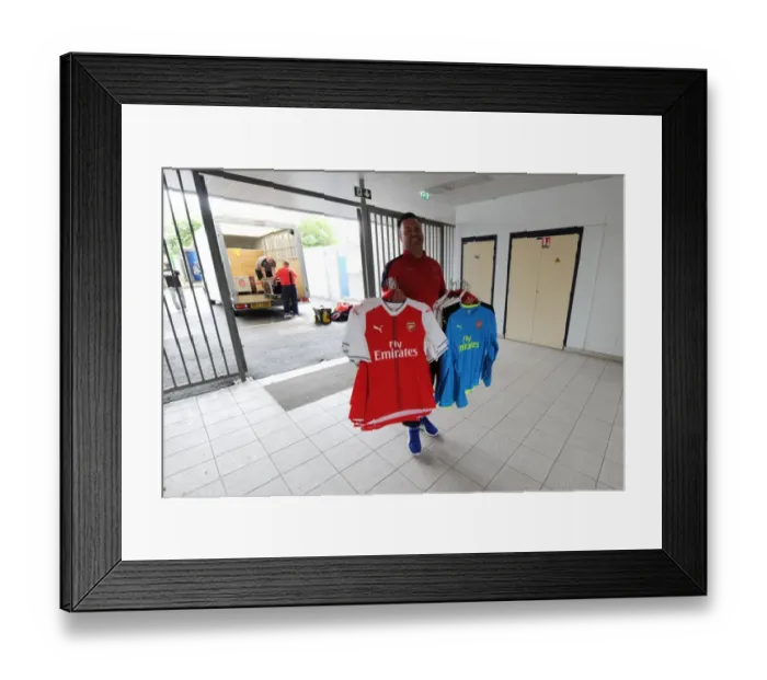 Framed Print : Arsenal Kit Man Paul Akers Preparing for Lens vs Arsenal Friendly (2016-17)