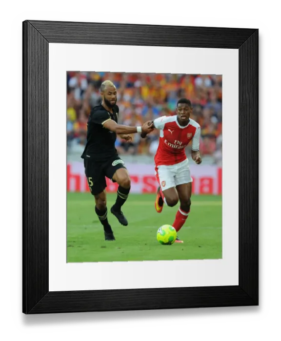 Framed Print : Arsenal's Jeff Reine-Adelaide vs. John Bostock in Intense Lens Friendly Clash, 2016