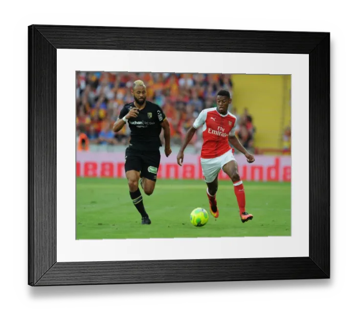 Framed Print : Arsenal's Jeff Reine-Adelaide vs John Bostock: Intense Face-Off in Lens Friendly, 2016