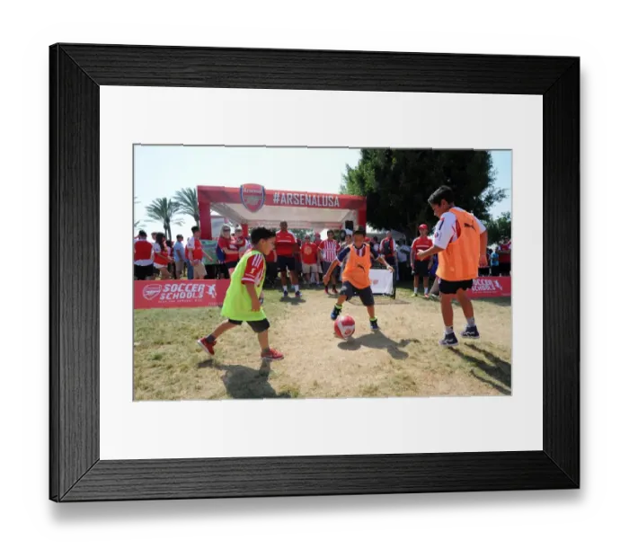 Framed Print : Fans at the fan area outside the stadium before the match
