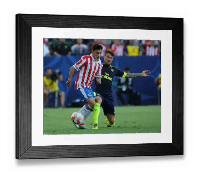 Framed Print : Arsenal vs. Chivas: Debuchy Tackles Torres in Pre-Season Clash Framed Print : Arsenal vs. Chivas: Debuchy Tackles Torres in Pre-Season Clash