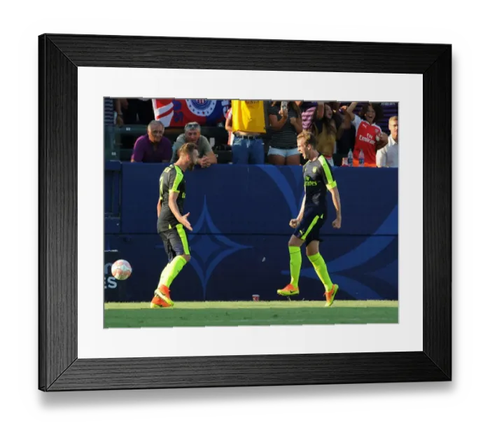 Framed Print : Arsenal's Holding and Chambers Celebrate Goal Against Chivas (2016-17) Framed Print : Arsenal's Holding and Chambers Celebrate Goal Against Chivas (2016-17)