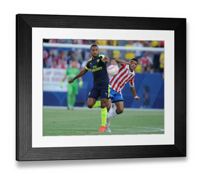 Framed Print : Theo Walcott Outmaneuvers Orbelin Pineda: Arsenal's Pre-Season Triumph vs. Chivas Framed Print : Theo Walcott Outmaneuvers Orbelin Pineda: Arsenal's Pre-Season Triumph vs. Chivas