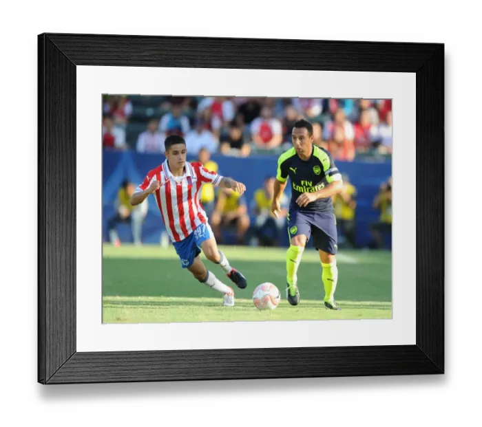 Framed Print : Arsenal's Santi Cazorla Outsmarts Chivas Edson Torres: A Pre-Season Masterclass
